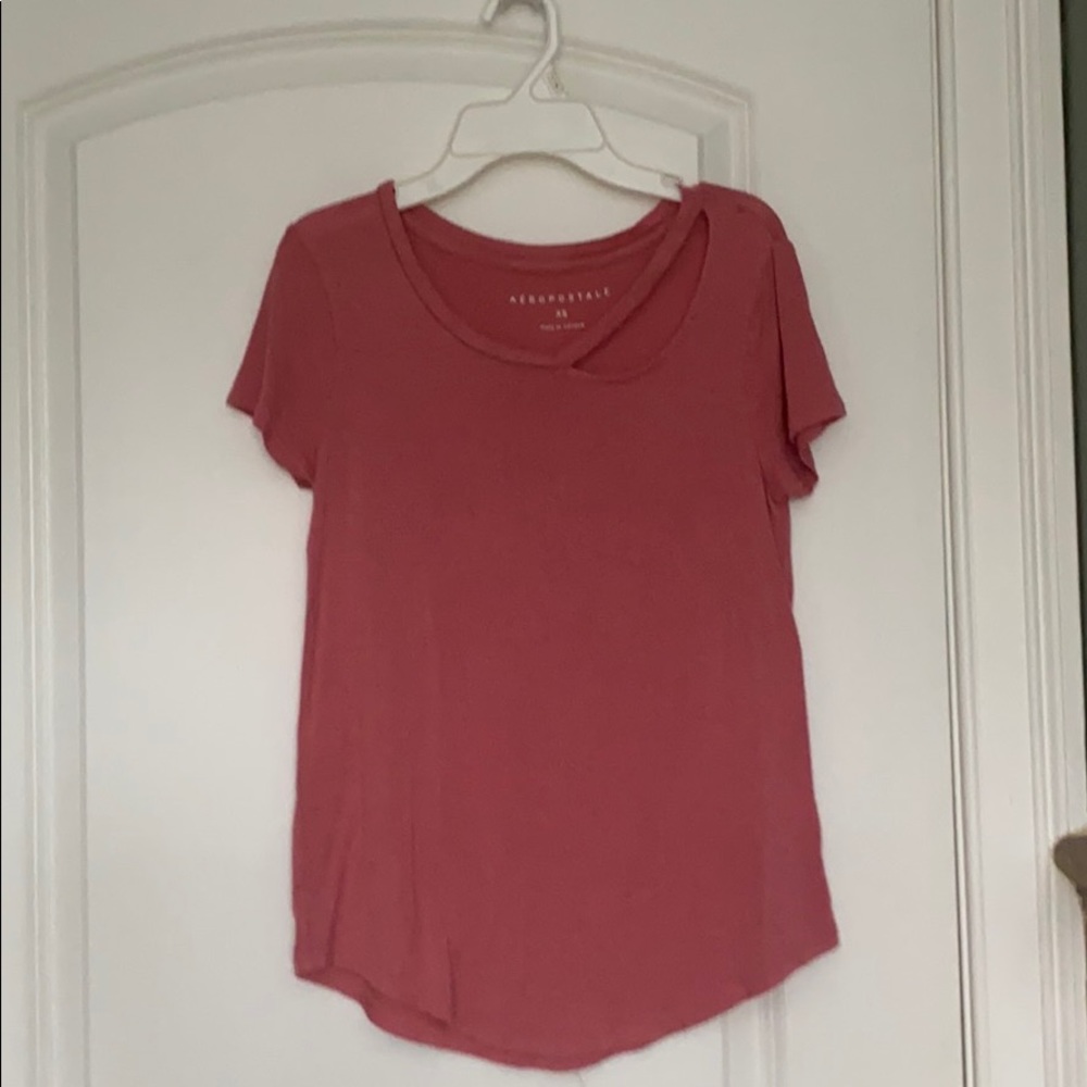 pink top with collar bone cut out